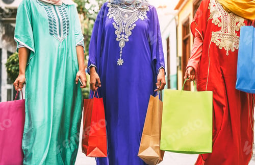 Preview: Happy Muslim women doing shopping in the city center