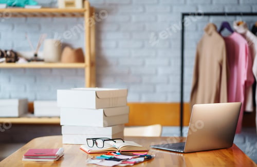 Preview: Small business owner, entrepreneur, seller using tablet checking ecommerce clothing store orders.
