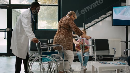 Preview: Elderly woman in wheelchair talking to little girl in waiting room