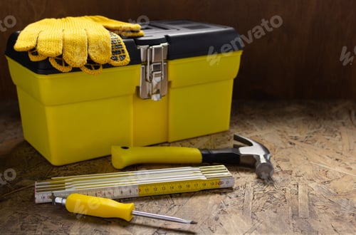 Preview: Construction tools and toolbox on wooden tablel background texture. Tool box
