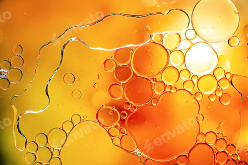 Preview: Abstract oil bubbles orange background. Macro shot