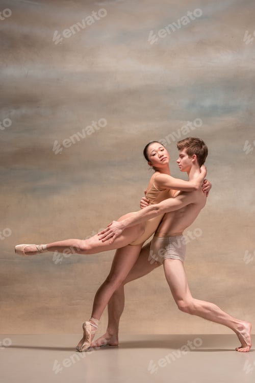 Preview: Couple Of Ballet Dancers Posing Over Gray Background