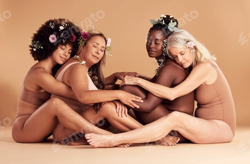 Preview: Beauty, flowers and women in lingerie hug while sitting on floor with eyes closed in studio on a br