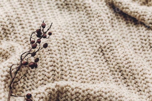 Preview: warm cozy sweater on rustic background with fir green branches