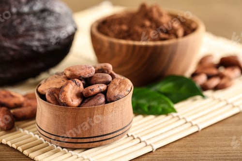 Preview: Wooden bowl of cocoa beans on table