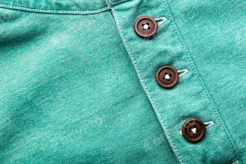 Preview: Teal Fabric with Brown Buttons Close Up