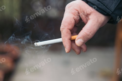 Preview: Person holding cigarette, Concept Quitting smoking, World No Tobacco Day