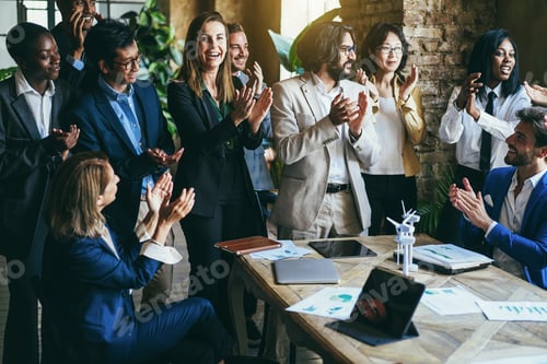 Preview: Multiracial business people celebrating together inside office - Focus on center senior woman face
