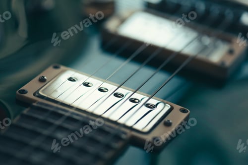 Preview: Electric guitar body and neck detail on wooden background