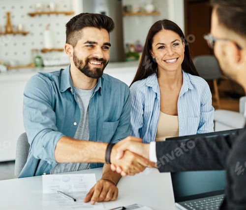 Preview: young couple shaking hands deal contract real estate investment business agreement agent handshake