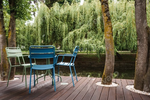 Preview: Beautiful shot of empty tables and chairs restaurant's outdoor seating area