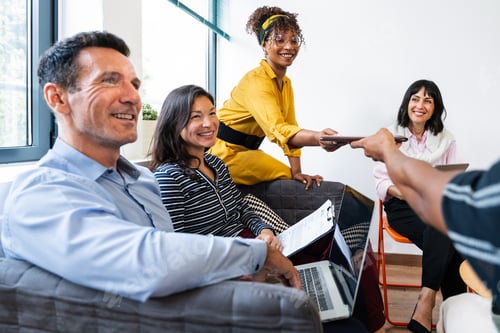 Preview: Business people exchanging ideas and documents during office meeting