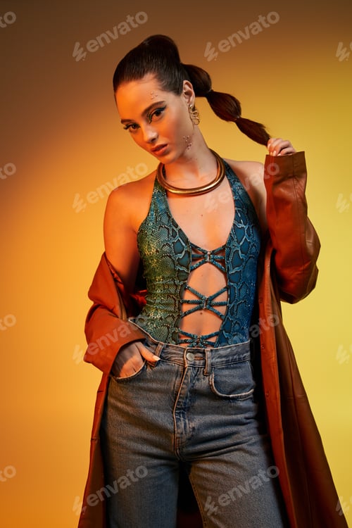 Preview: A beautiful young woman models stunning snake print attire with bold makeup, exuding confidence.