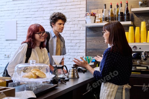 Preview: Customers of coffee shop making an order, talking to female barista cafe worker