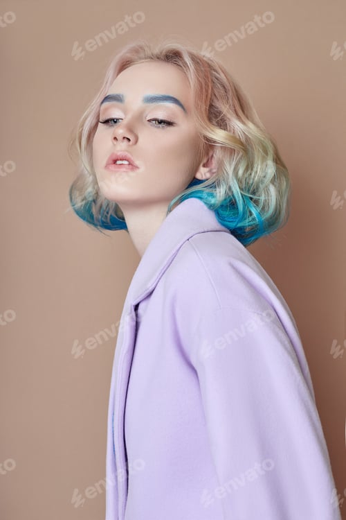 Preview: Portrait woman spring bright colored flying hair, all shades purple blue. Hair coloring