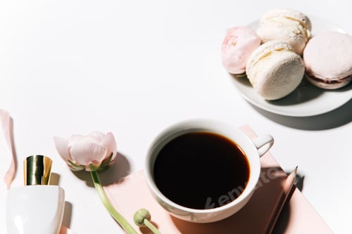 Preview: top view of cup of coffee and peony flowers on white background