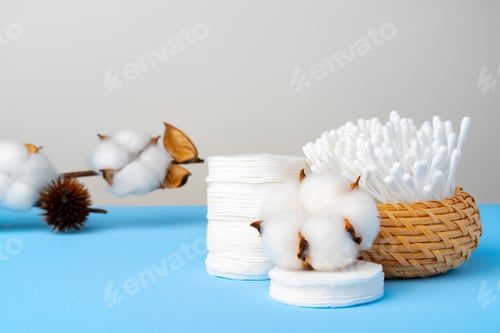 Preview: Set of cotton buds sticks on blue paper