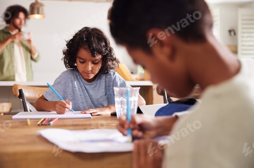 Preview: Two brothers drawing at kitchen table