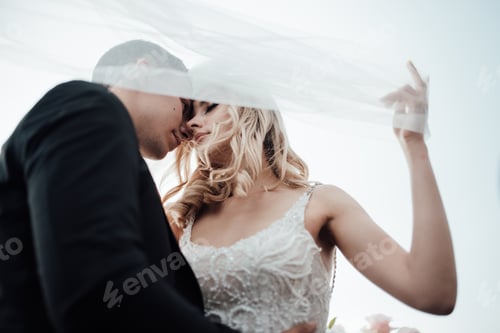 Preview: Happy authentic candid couple in love at VW cabriolet date in wedding dresses outdoor