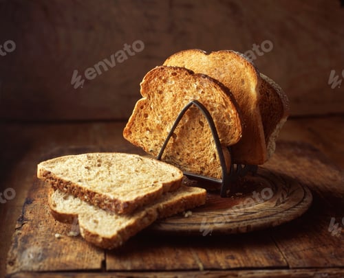 Preview: White and brown toast in toast rack, close-up