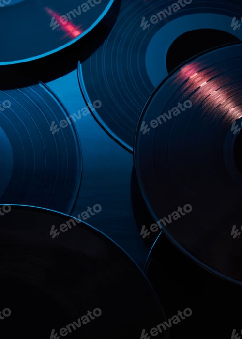 Preview: Artsy shot of vintage vinyl records illuminated by a soft blue light