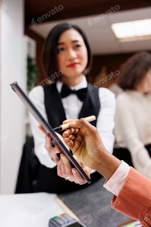 Preview: African american woman signing papers