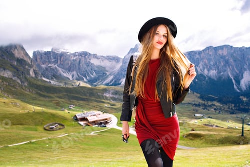 Preview: Magnificent fashionable young model woman posing at Alp mountains