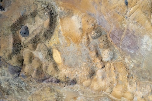 Preview: Drone Aerial view revealing intricate textures and patterns of eroded terrain