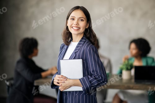 Preview: Happy Brunette Businesswoman Holding Digital Tablet Posing At Modern Office