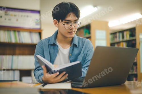 Preview: Male college students are working on laptops and searching for books to study