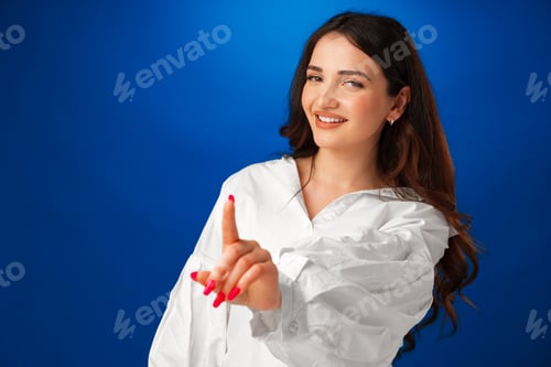 Preview: Confident young woman showing stop gesture, pointing finger