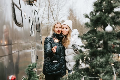 Preview: Mother and Daughter Celebrate Christmas with Sparklers