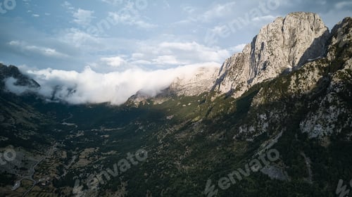 Preview: Aerial view of beautiful mountains in Albania and cloudy sky on a sunny day
