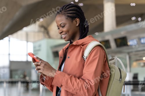 Preview: Happy afro girl check cellphone message after first flight after covid-19 end and arrival in airport