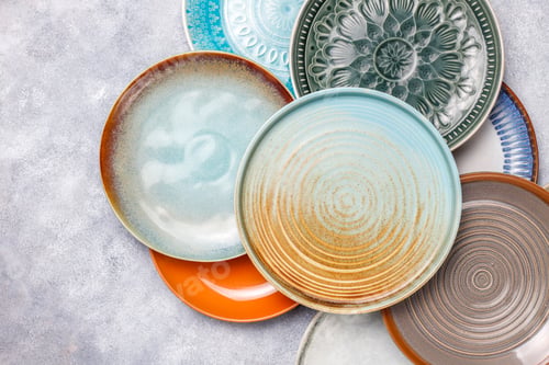 Preview: Different ceramic empty plates and bowls.