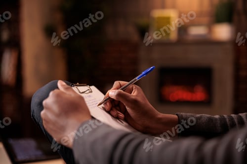 Preview: Professional counselor taking notes on paper at couple therapy