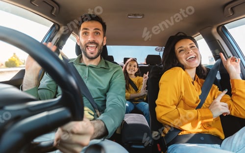 Preview: We are going on vacation. Happy family of three driving in their automobile, dancing to music and