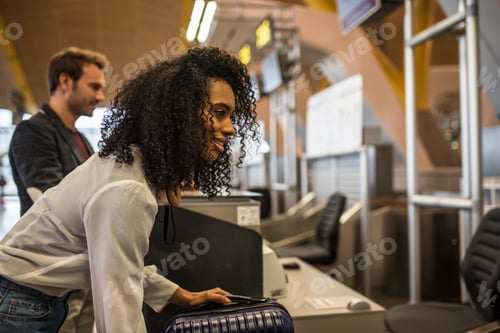 Preview: People check-in luggage at the airport