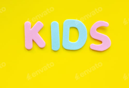 Preview: Word Kids made of colorful letters on yellow background, flat lay with copy space.