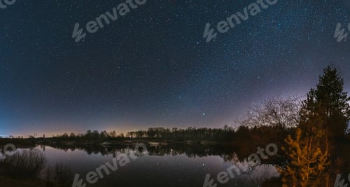 Preview: Belarus, Eastern Europe. Night Sky Stars Above Countryside Landscape With River. Natural Starry Sky