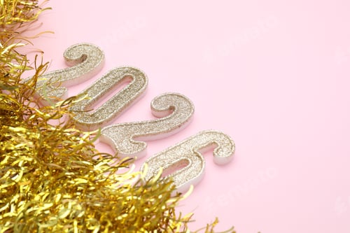 Preview: New 2026 Year. Golden numbers and shiny tinsel on pink background, closeup. Space for text