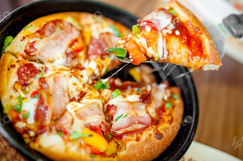 Preview: Hot cannibal slice of pizza with extra bacon, ham and vegetables