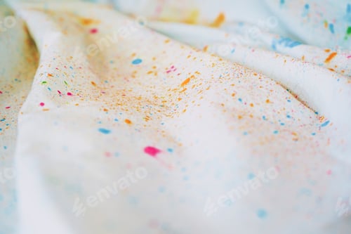 Preview: Holi dust splash over a white curtain