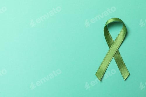Preview: Green awareness ribbon on mint background, space for text
