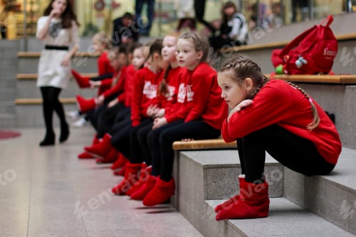 Preview: Young little girls in sportive wear waiting to perform at a dance competition. N