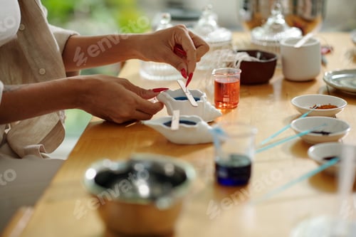 Preview: Woman Making Handmade Candles From Forms