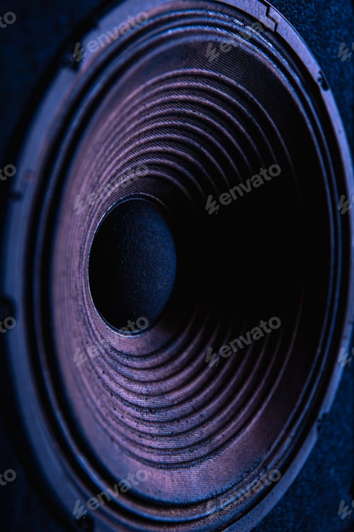 Preview: Close-up of speaker membrane on black background.