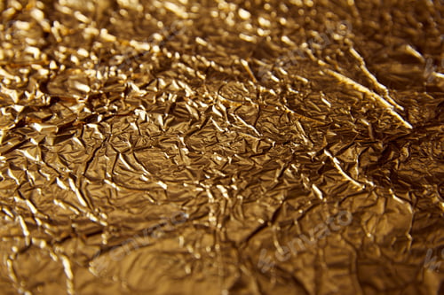 Preview: selective focus of sheet golden foil with glares
