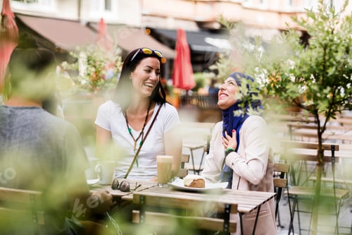 Preview: Group of people sitting at outdoor cafe table
