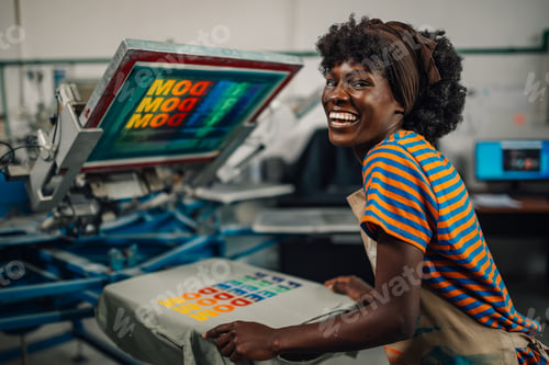 Preview: Portrait of happy diverse graphic worker with screen printed t-shirt
